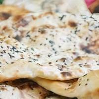 Sesame Naan · Handmade bread topped with roasted sesame seeds. (contains eggs)