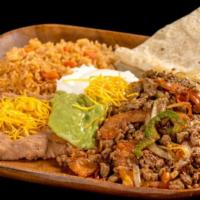 Fajitas Combination Plate · Chicken or steak mixed with onion, bell pepper, and tomato topped with guacamole and sour cr...