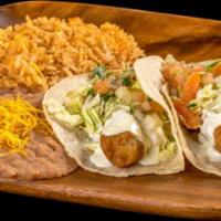 Two Fish Tacos Combination · With a side of rice and beans.