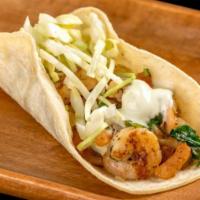 Shrimp Tacos · Grilled shrimp, pico de gallo, cabbage, and tartar sauce.