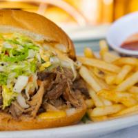 Kalua Pork Sandwich · Uncle dick yamane's favorite! Slow roasted lua'u style pork served with shredded cabbage and...