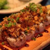 Half Baked Roll · California roll topped with baked fish with spicy mayo, masago, unagi sauce and green onions.