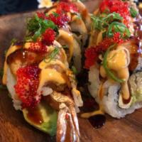 Volcano Roll · Tempura shrimp, cream cheese, cucumber & avocado topped with spicy tuna, eel sauce, spicy ma...