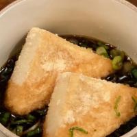 Agedashi Tofu · Fried tofu, green onions. in warm tempura broth.
