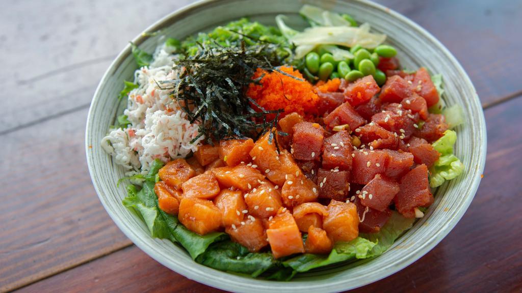 Tuna & Salmon · Crab salad, masago, seaweed salad, pickled ginger, cucumber, edamame, mixed greens, sesame seeds and steamed rice.