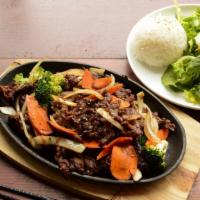 Grilled Bulgogi · Rib-eye steak marinated in house ponzu sauce, steamed rice, salad.