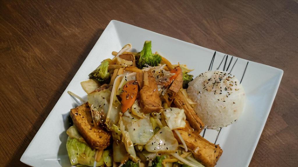 Tofu With Assorted Veggies · Choice of fried or fresh tofu. Stir-fried with assorted veggies and a hint of chili sauce. Served with steamed rice.