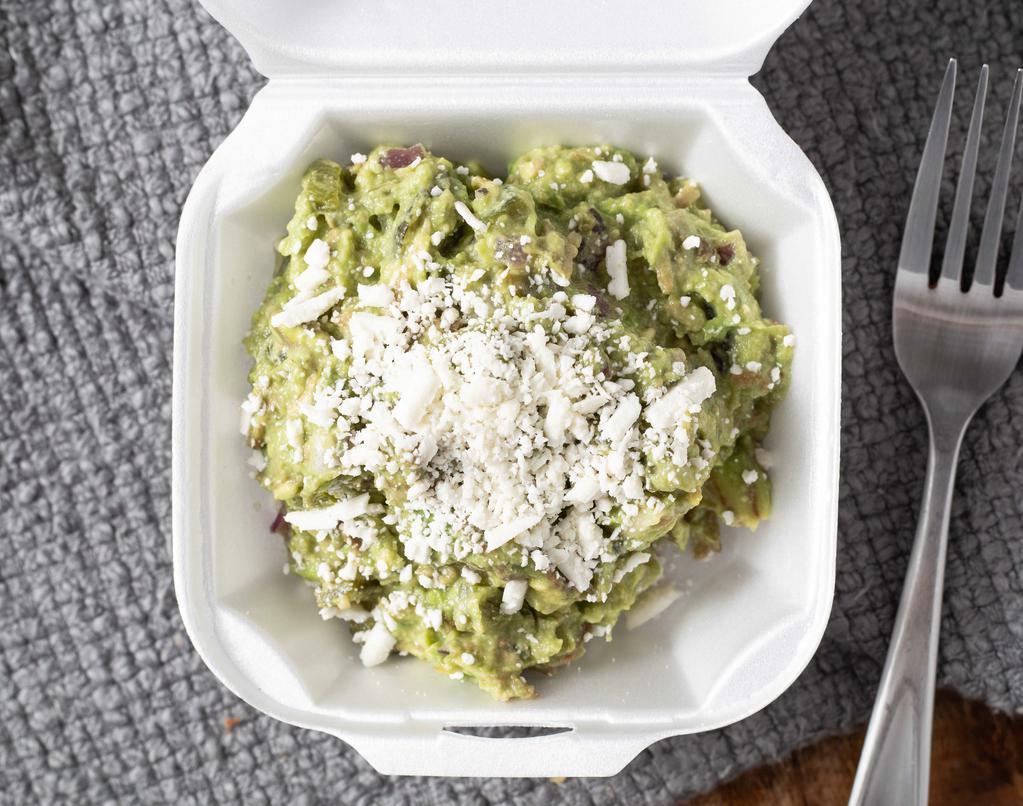 Guacamole · Avocado mixed with roasted poblano pepper and red onion. Seasoned with salt, lime juice topped with Cotija cheese.