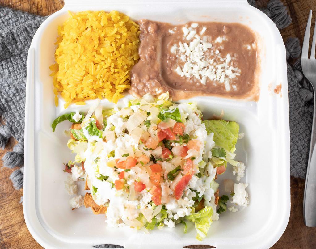 Flautas · Chicken flautas topped with guacamole, lettuce, sour cream and queso fresco. Served with beans and rice.