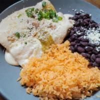 Crema Blanca Chicken · Chipotle cream sauce, toasted almonds, green onions, queso fresco, rice and black beans