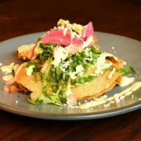 Tacos Dorados · Crispy corn tortillas, lettuce, jalapeno cheese, tomatoes, red onions, avocado, lime cream, ...