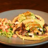 Grilled Skirt Steak Tacos · Cascabel salsa, cilantro, onions, guacamole, rice and black beans. 

Consuming raw or underc...
