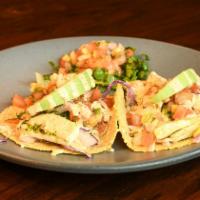 Crispy Wild Alaska Cod · Lemon-scallion, cilantro jicama slaw, avocado, mango pico de gallo, rice and black beans.