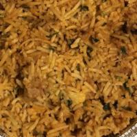 Chicken Biryani · Aromatic basmati rice with chicken pieces cooked with nuts, herbs and spices.