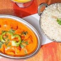Chicken Tikka Masala · Marinated boneless white meat cooked in tandoor in a special tomato ginger and cream sauce.