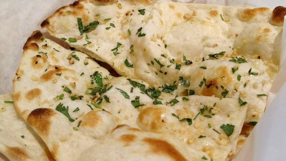 Chili Naan · Simple naan with a fresh green chilies spread on top.