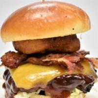 Bbq Burger   
 · 1/3LB ANGUS CHUCK GROUND BEEF PATTIES - SERVED ON GRILLED BRIOCHE BUN, BACON, CHEDDER CHEESE...