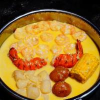 Combo C · 1/2 lb shrimp (no shell), 1/2 lb. scallop, 1 lobster tail, 1 corn and 2 potatoes.
