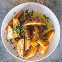 Greek Potatoes · oregano, garlic and lemon. 

Allergens In This Dish: garlic, onion.

This dish cannot be mod...