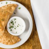 Empanadas De Carne · Stuffed pastry with Cuban ground beef served with aioli dip.