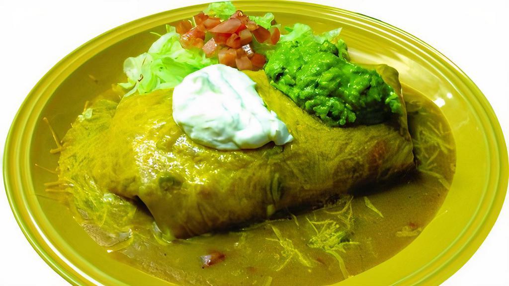 Burrito Supreme · Your choice of ground beef, chicken, asada, shredded beef, carnitas, with beans guacamole and sour cream.