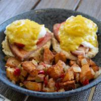 Green Eggs & Ham · Sliced smoked ham, fresh tomatoes, poached eggs over buttermilk biscuits, topped with green ...