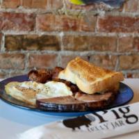 The Bacon Egg And Cheese · Your choice of our house recipe breakfast sausage, local bacon, or country ham, served with ...