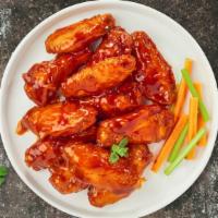 Blazing Buffalo Chicken Wings · 6 Pcs Fresh chicken wings breaded, baked until golden brown, and tossed in buffalo sauce. Se...