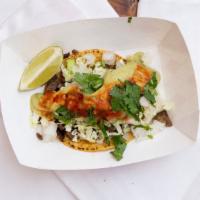 Taco De La Carreta (Street Taco) · Corn tortilla, choice of meat, cabbage or lettuce, cilantro, onions, avocado sauce, salsa an...