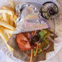 Lamb Gyro Combo · Sliced lamb on grilled pita bread with tzatziki, tomato, onion, cucumber and lettuce. Served...