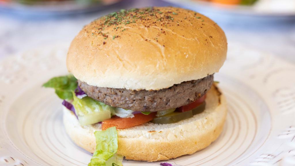 Veggie Burger Combo · Veggie pattie, salad, pickles, onions, tomatoes, garlic sauce, hot sauce, sumac seasoning, parsley.