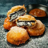 Munchin' Oreos (4) · Four Mega stuffed Oreos battered in sweet house special mix. Topped with powder sugar. Serve...