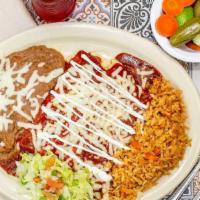 Two Enchiladas Plate · Two corn tortillas stuffed with your choice of cheese, chicken or beef, topped off with  cho...