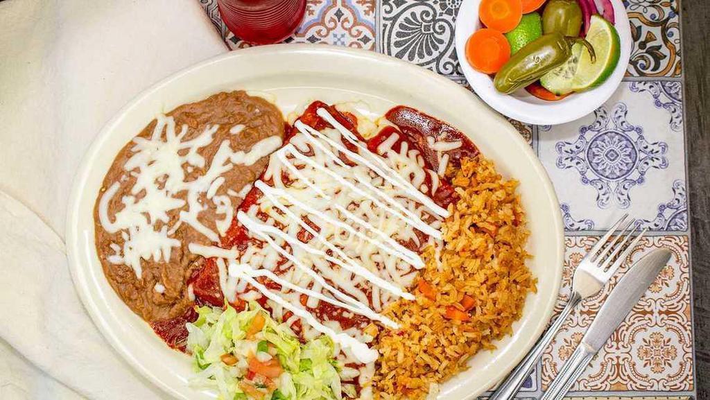 Two Enchiladas Plate · Two corn tortillas stuffed with your choice of cheese, chicken or beef, topped off with  choice of green or red salsa, sour cream and cheese.