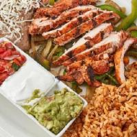 Fajitas · Sautéed peppers and onions with your choice of chicken, carne asada or shrimp. Acomppanied w...