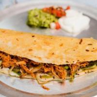 Corn Quesadilla · Corn Masa tortilla filled with cheese, grilled bell pepper and onions. Served with pico, sou...