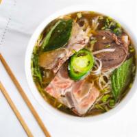 Pho Dac Biet · (Combination cuts of beef) rare steak, well done briskets, meatball, tendon, tripe and homem...