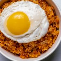 Kimchi Fried Rice (김치 볶음밥) · Stir-fried rice with, Kimchi, spam, and topped with a fried egg.