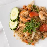 Fried Rice Thai 65 · Stir-fried steamed rice with onions, tomato, and egg. Served with choice of protein.