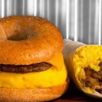Sausage, Egg & Cheese Sandwich · Warm sausage and fluffy eggs covered with cheese served on bagel or croissant. Made fresh al...