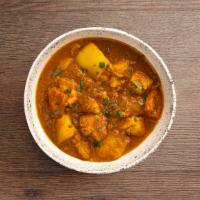 Chicken Vindaloo · Boneless chicken and potatoes cooked in a spicy hot curry.