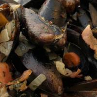 Steamed Mussels · Fresh mussels sautéed with fennel, garlic, and bacon. Sprinkled with fresh herbs and deglaze...