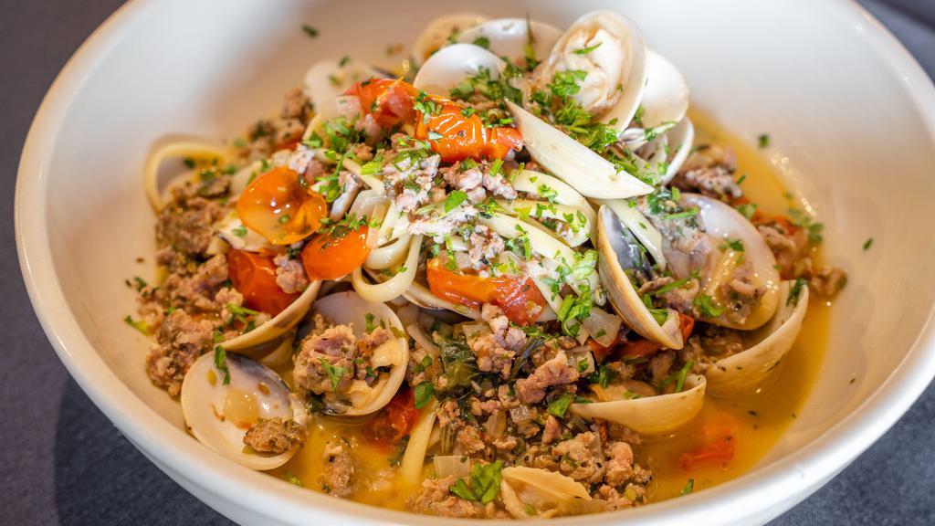 Clams And Fennel Sausage · Clams, fennel sausage, fresh tomato, basil, garlic and oregano tossed with linguine with a deglazed white wine.