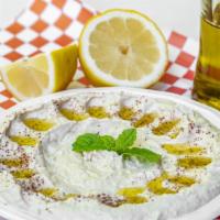 Hummus Plate · Puréed chickpeas with tahini sauce lemon juice serve with pita bread and extra virgin olive ...