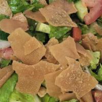 Fattoush Salad Plate · Chopped romaine lettuce onions tomatoes dried mint with the special house dressing crispy pi...
