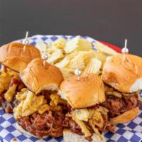 Pulled Pork Sliders · Four sliders with beer-braised pork, house made BBQ sauce, crispy onions, served with chips.