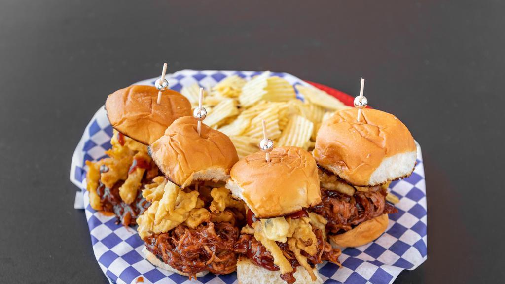 Pulled Pork Sliders · Four sliders with beer-braised pork, house made BBQ sauce, crispy onions, served with chips.