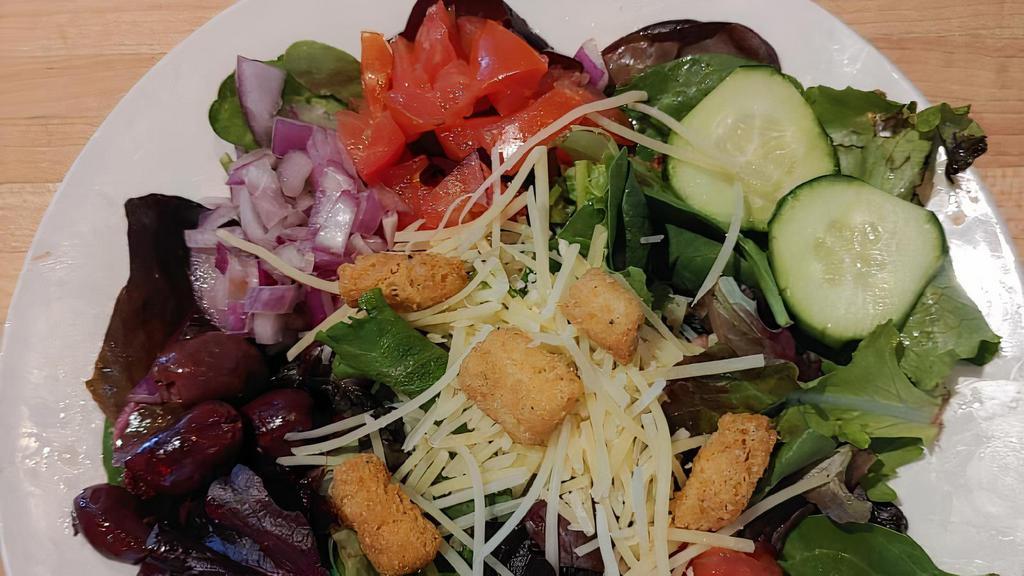 Side Salad · Mixed greens, tomato, cucumber, red onion, Kalamata olives, Parmesan cheese with house made dressings: lemon pesto vinaigrette, red wine vinaigrette or ranch.