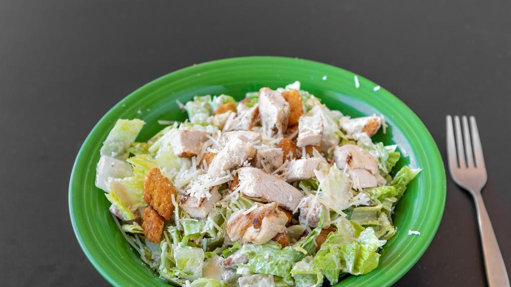 Caesar Salad With Chicken · Romaine lettuce, tomatoes, Parmigiano Reggiano cheese, tomatoes, croutons, Caesar dressing, with grilled chicken.