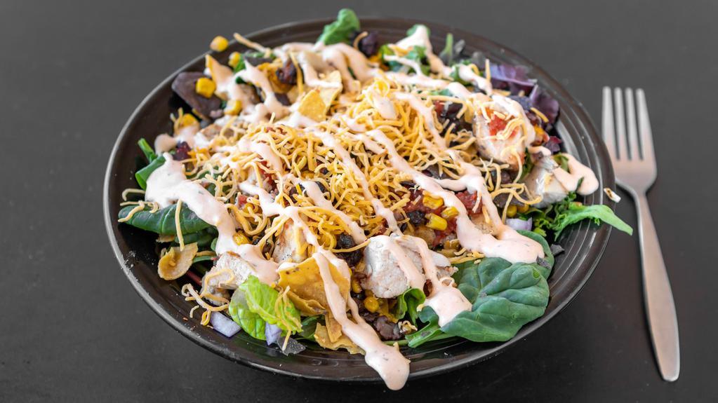 Half Zozobra Spicy Salad · Hot grilled chicken, corn, black beans served on mixed greens with onion, salsa, tortilla chips, Cheddar cheese topped with house made chipotle ranch dressing.